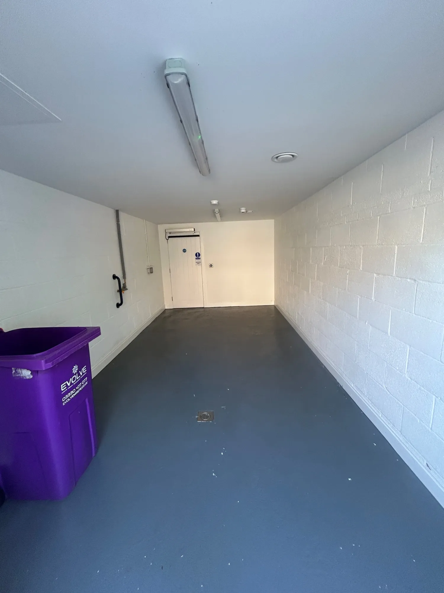 Bin store floor in Rickmansworth after being chemically cleaned and rinsed down